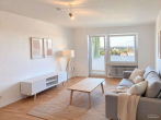 Wohnzimmer - (KI generiert) - Augsburg von oben: Gemütliche 3-Zimmer Wohnung mit Tiefgaragenstellplatz